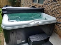 working hot tub with opened cover