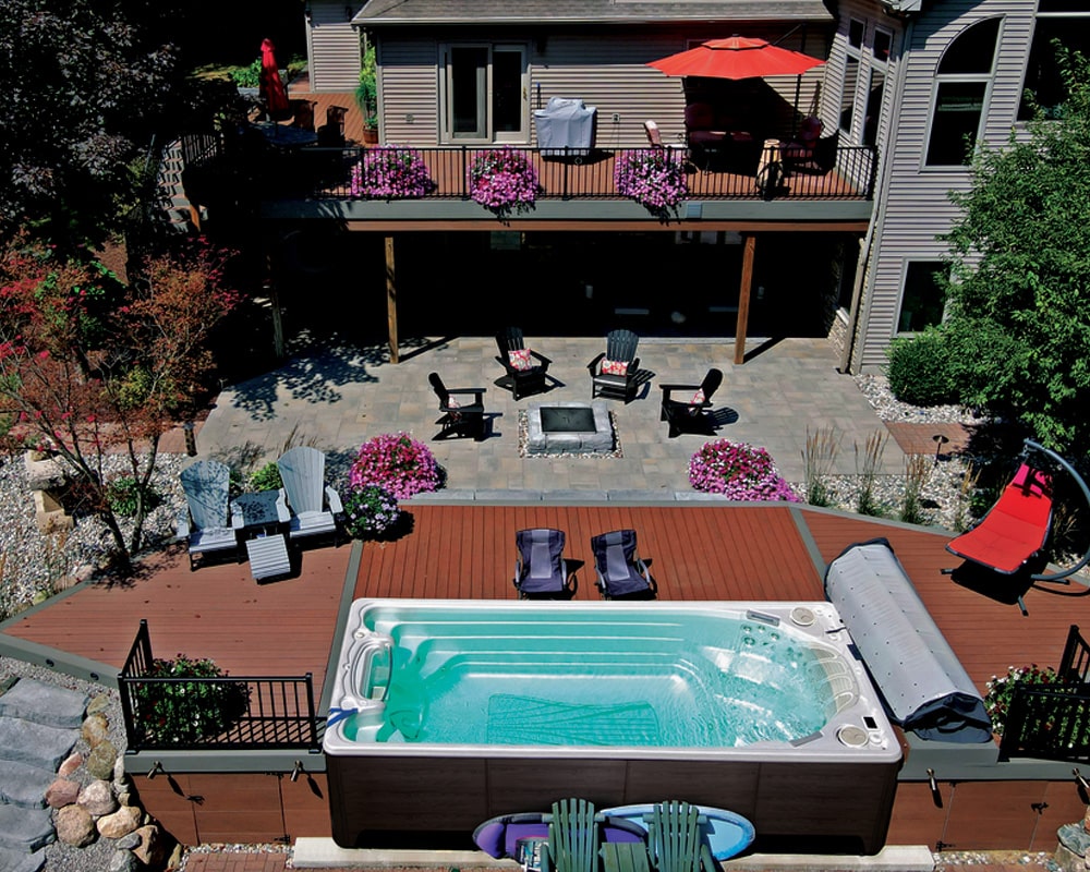large rectangular swim spa on a wooden deck