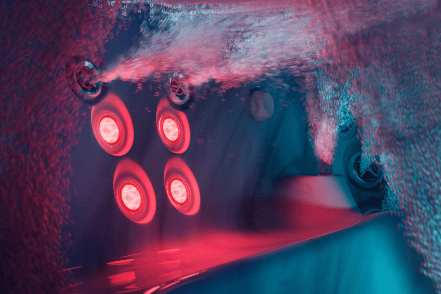 Luxury hot tub wellness features with interior lighting and IR red light therapy zones
